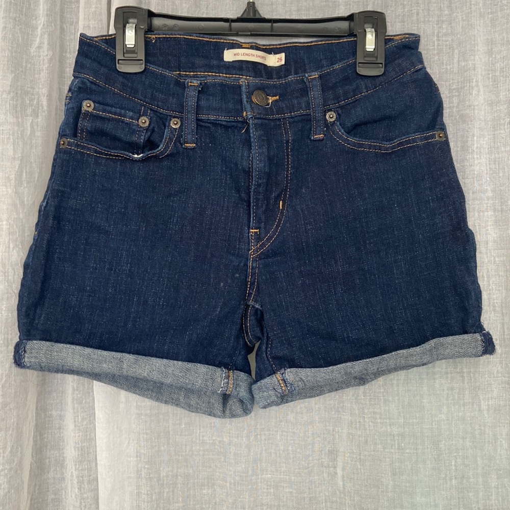 Dark wash cuffed mid length Levi shorts